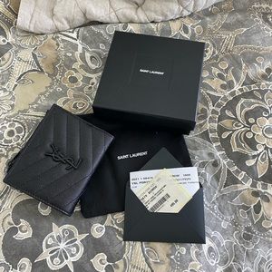Like new YSL wallet. Asking price $250.
